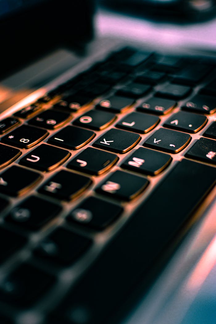Macro shot of a laptop keyboard highlighting its sleek design and modern technology.